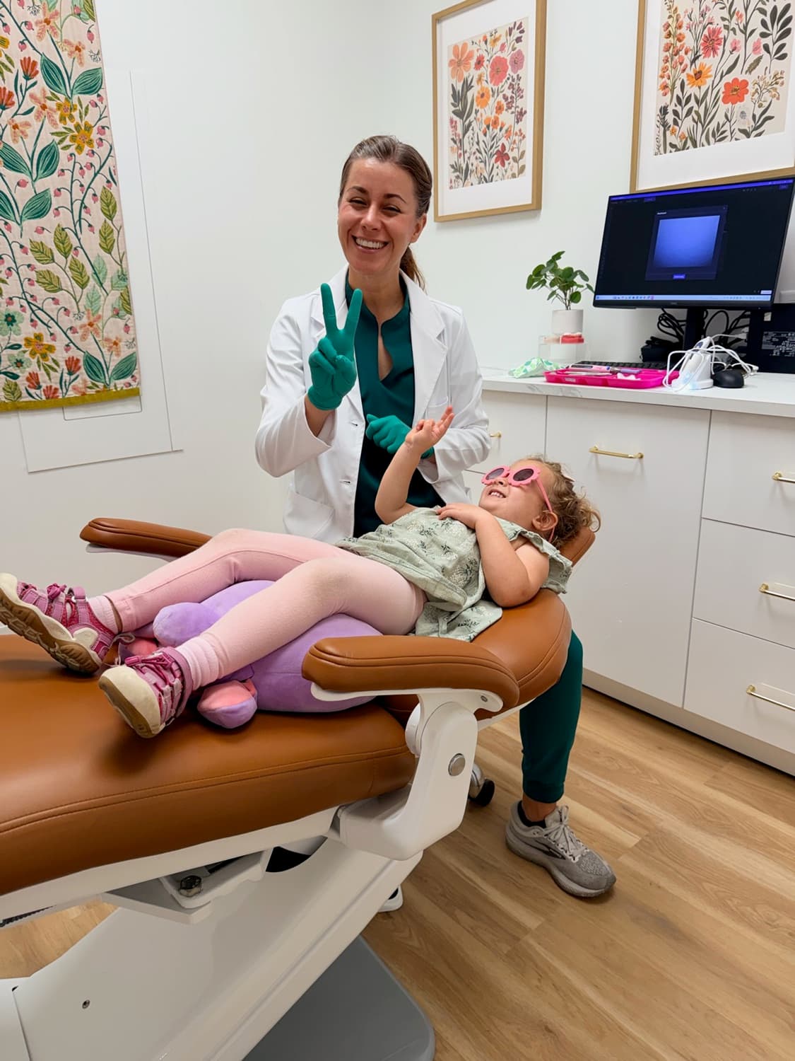 Dr. Kacie Culotta with a young patient at Latched Beginnings