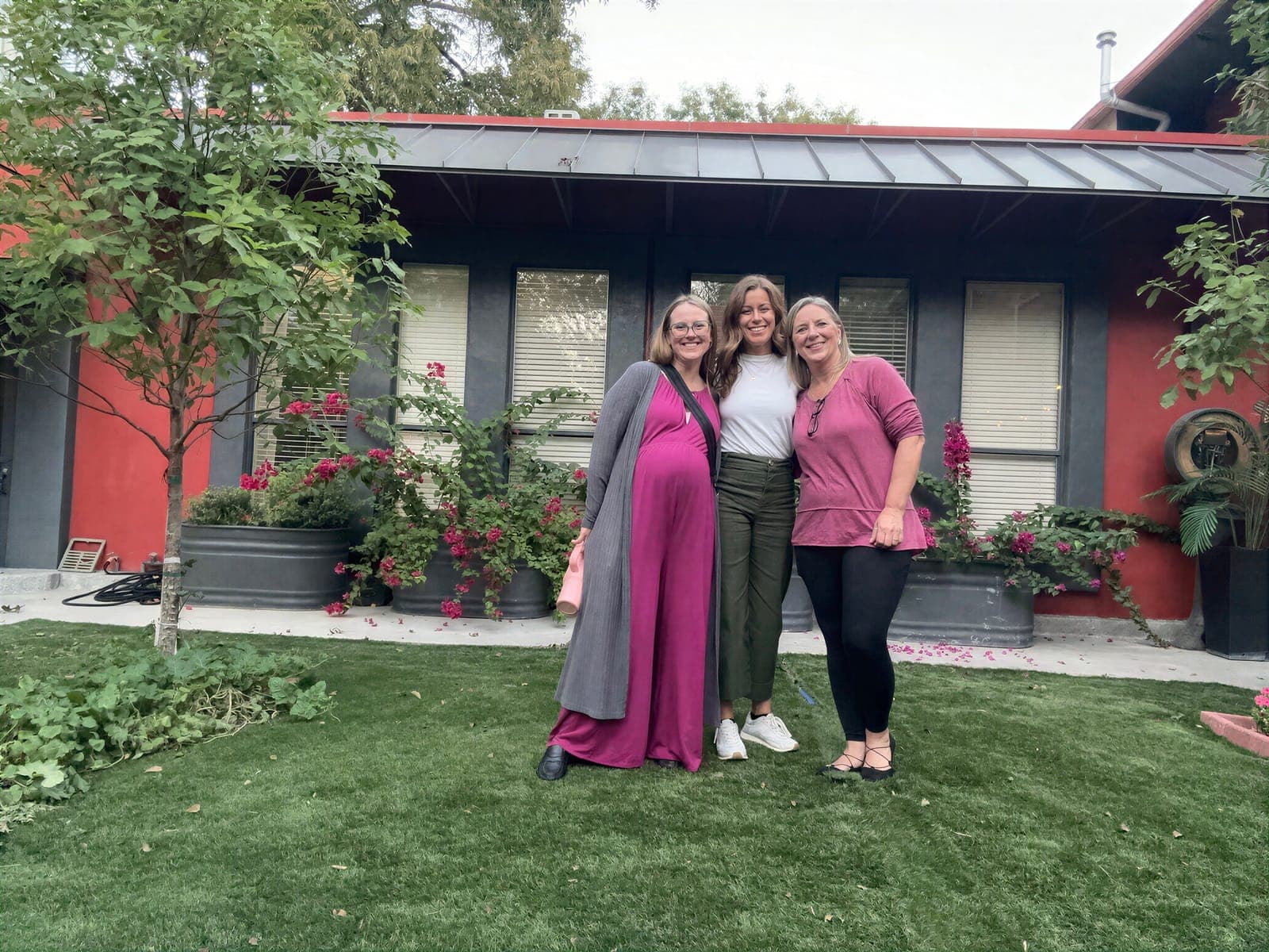 Dr. Kacie Culotta with two birth professionals outside the Latched Beginnings office